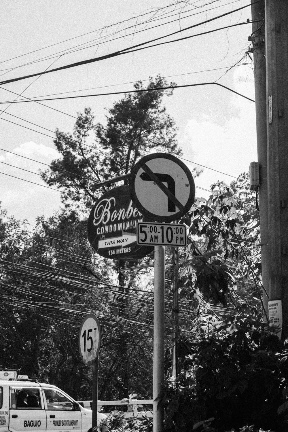 a black and white photo of a street sign