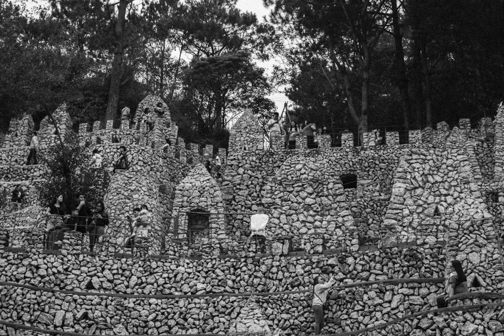 a black and white photo of a stone wall