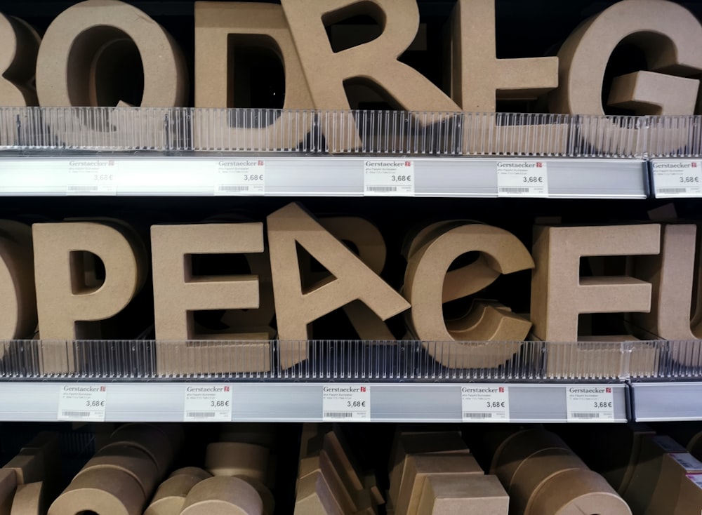 a store shelf filled with cardboard letters and numbers