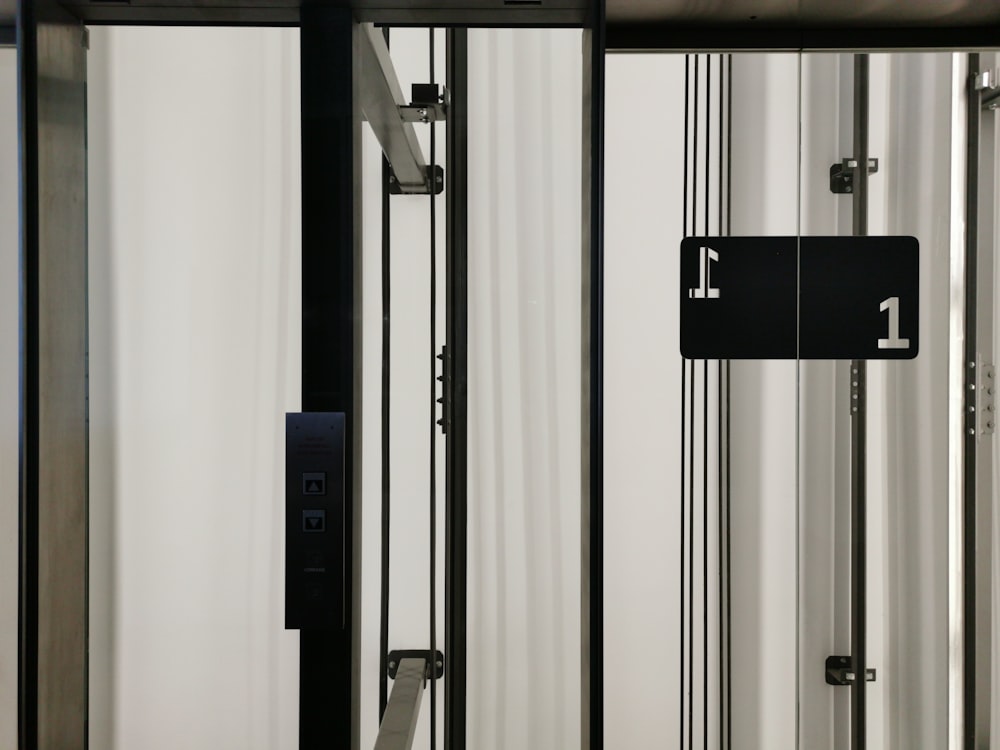 a black and white photo of a door with numbers on it