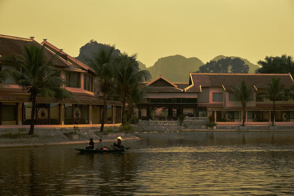 a couple of people in a boat on a body of water