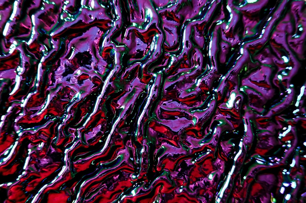 a close up of a red and purple liquid