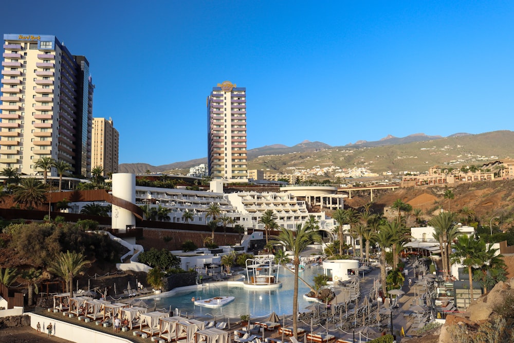 a view of a city with tall buildings and a swimming pool