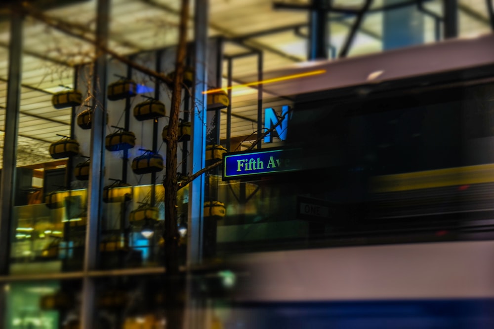 a blurry photo of a train passing by a building