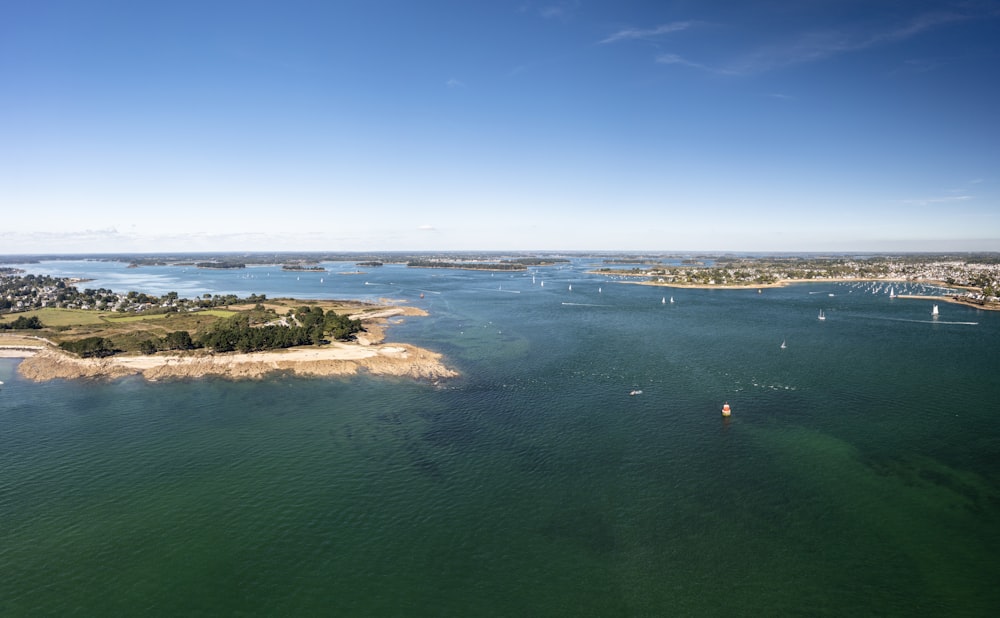 a body of water with a small island in the middle of it