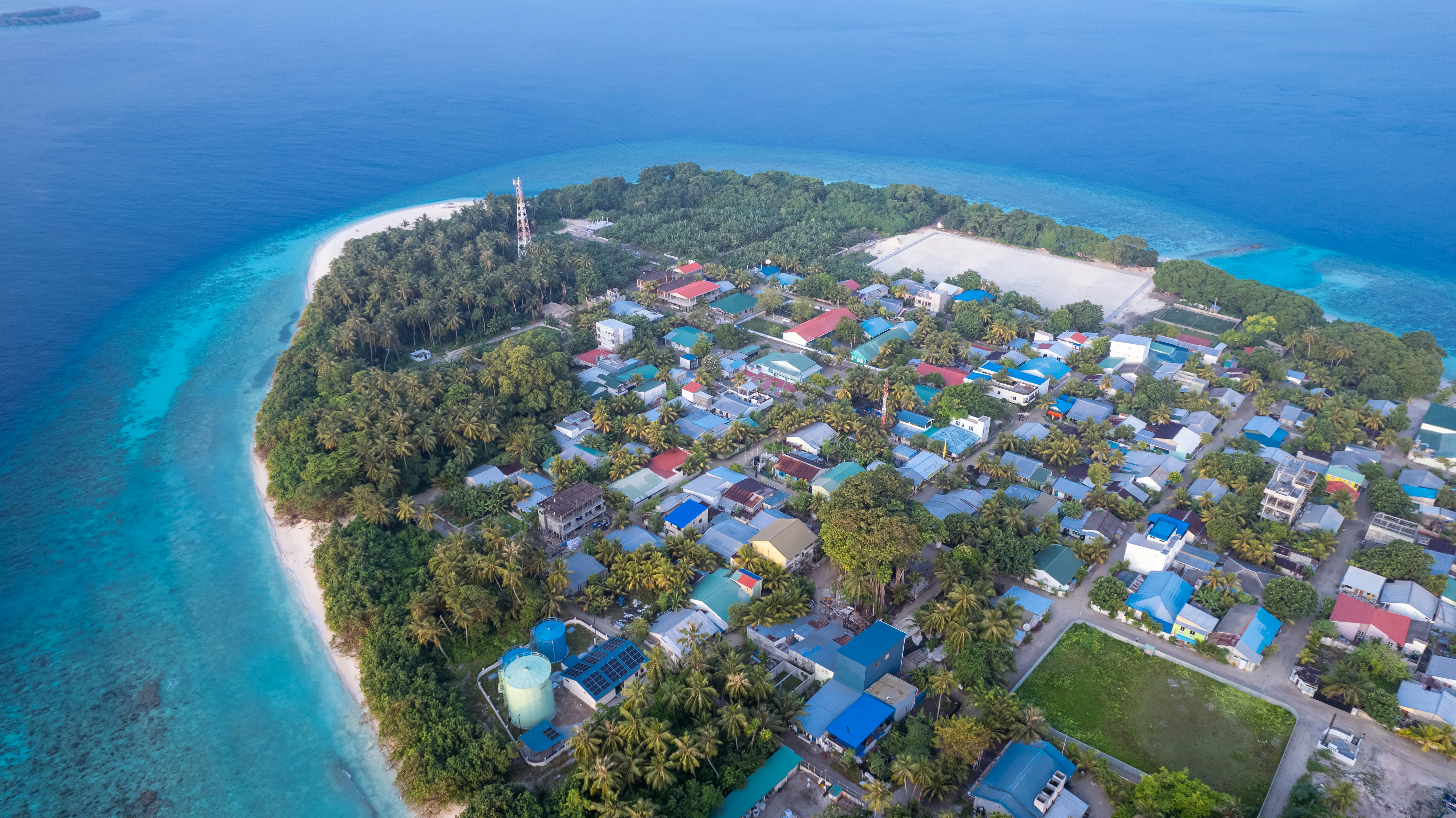 an aerial view of a small island in the middle of the ocean
