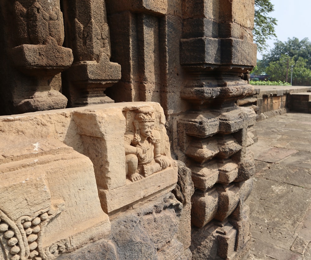 a close up of a stone carving on a building