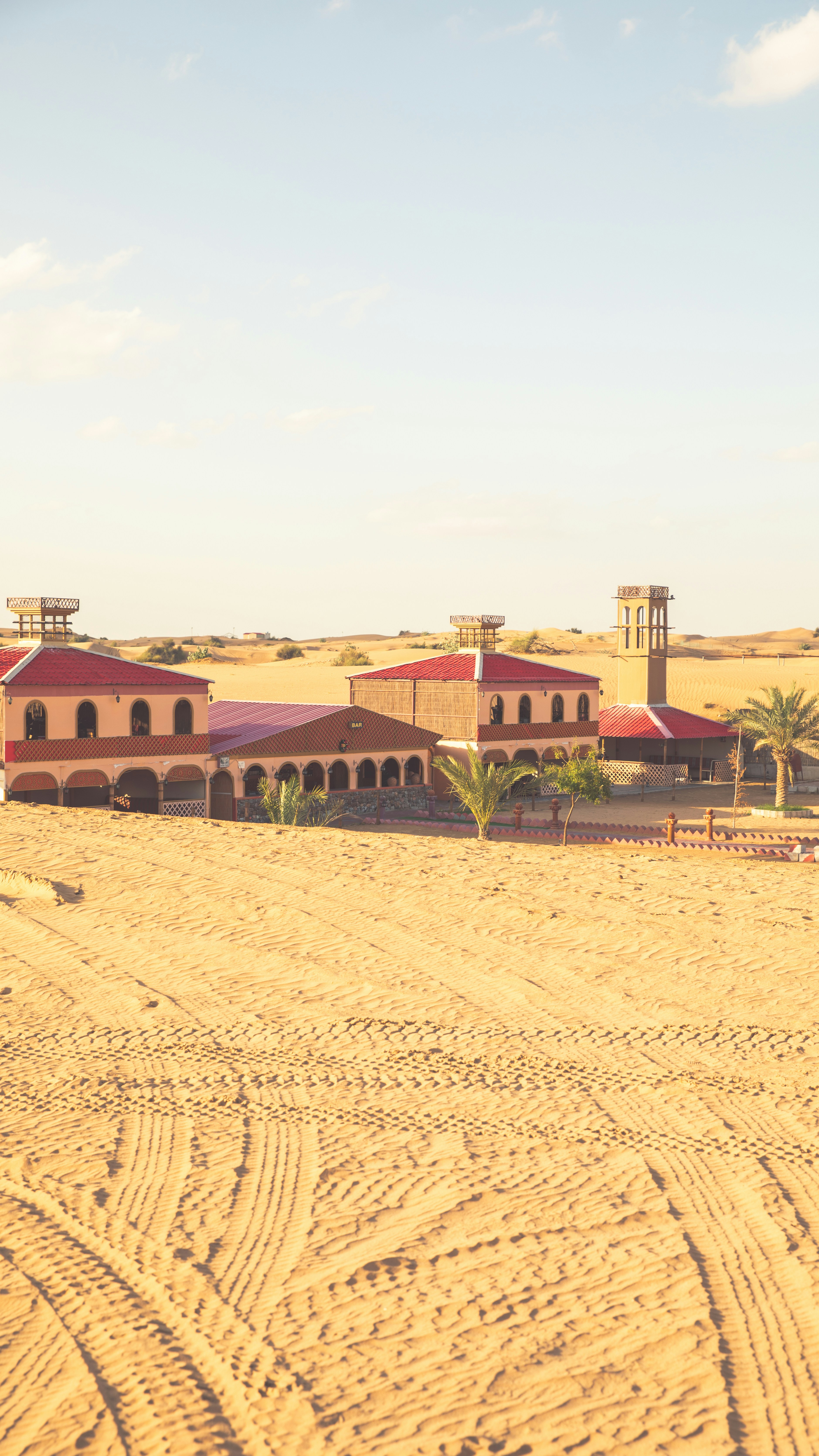 a large building in the middle of a desert