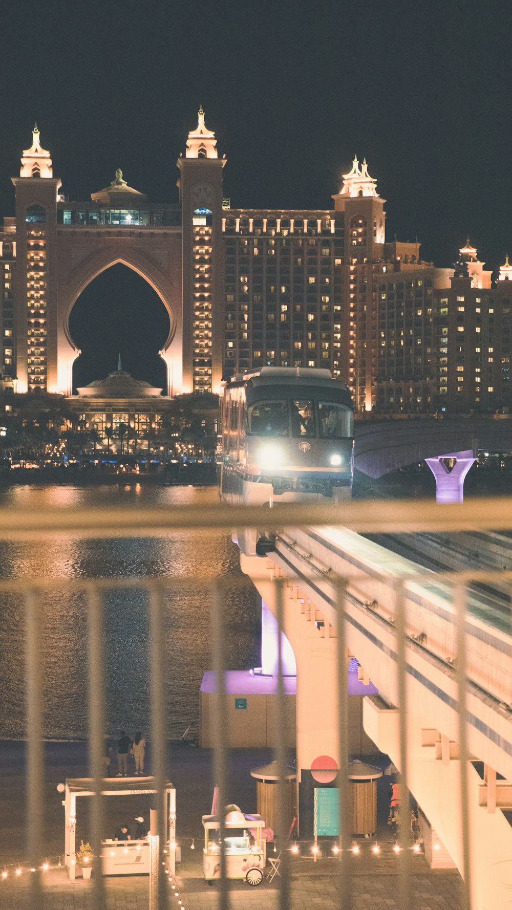 a train on a train track in front of a city