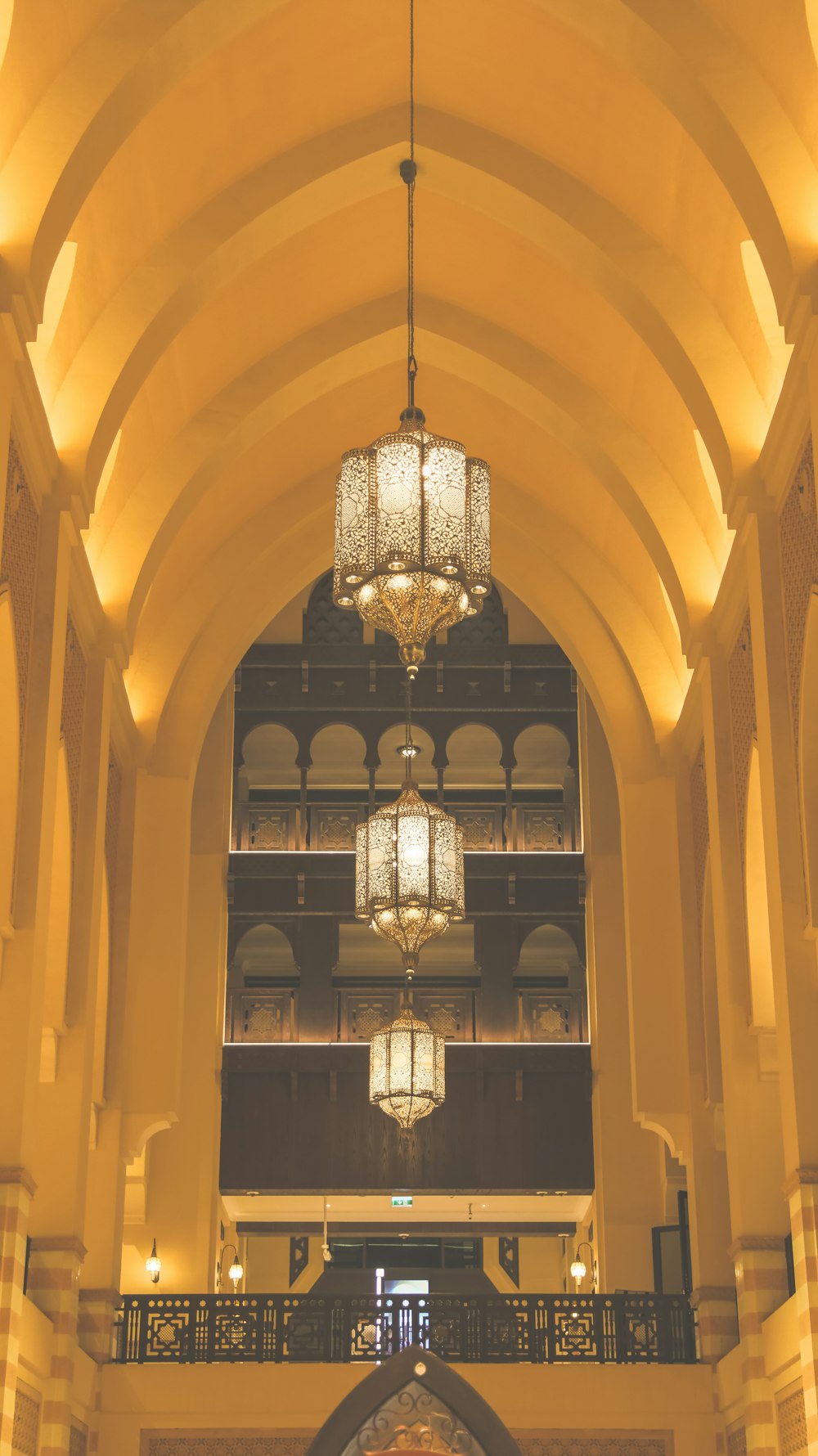 a chandelier hanging from the ceiling of a large building