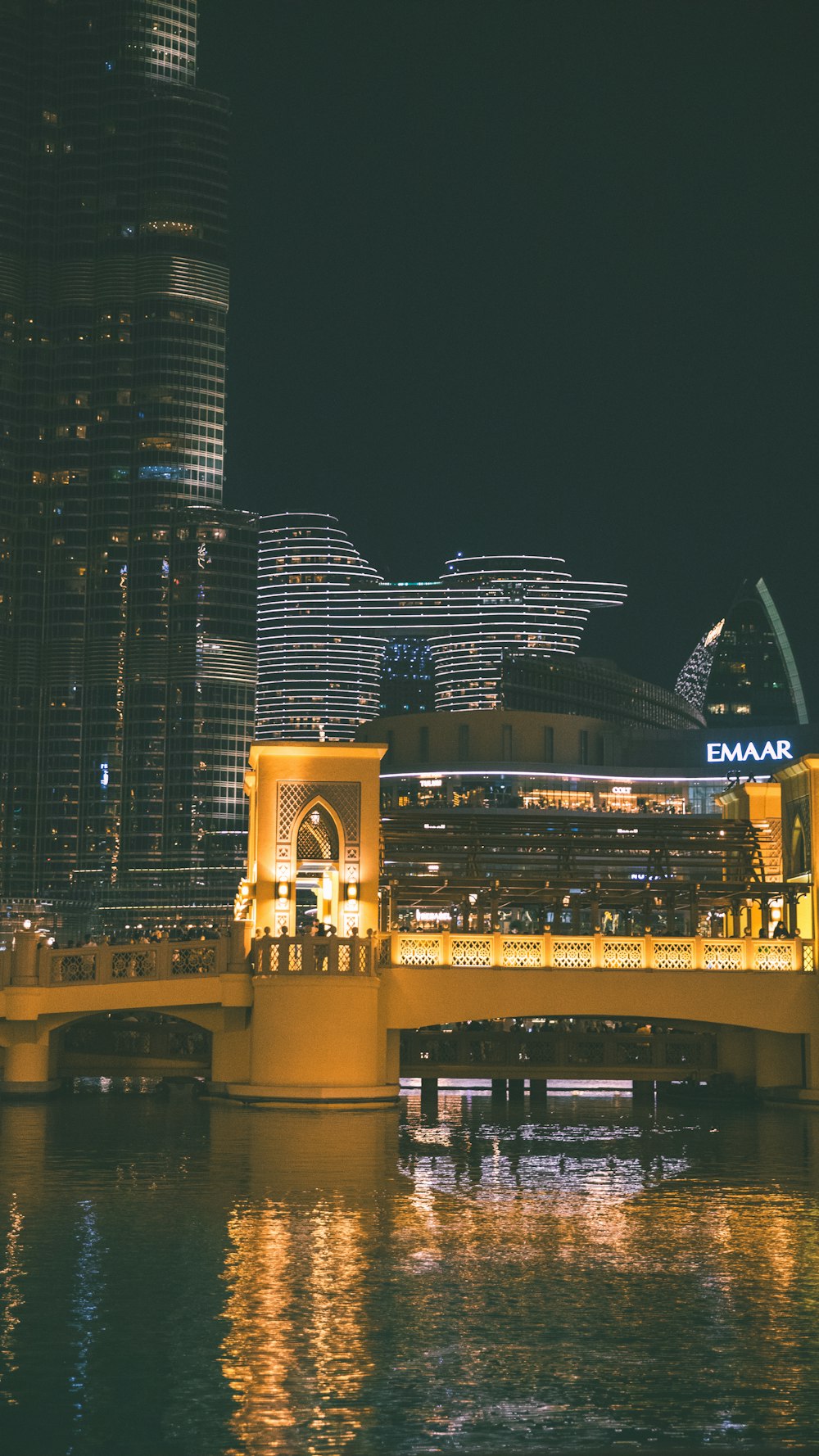 a bridge over a body of water at night