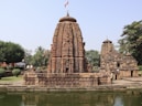 a large stone structure sitting next to a body of water