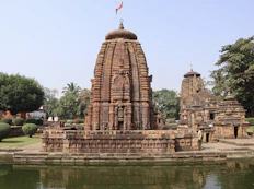 a large stone structure sitting next to a body of water