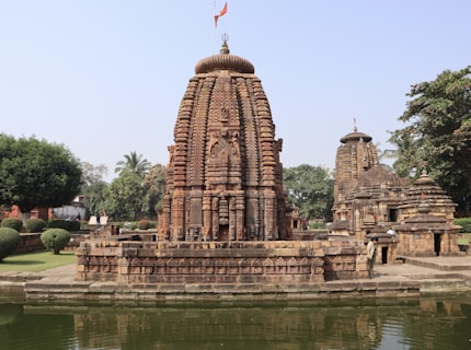 a large stone structure sitting next to a body of water