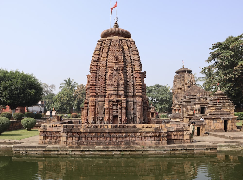 a large stone structure sitting next to a body of water