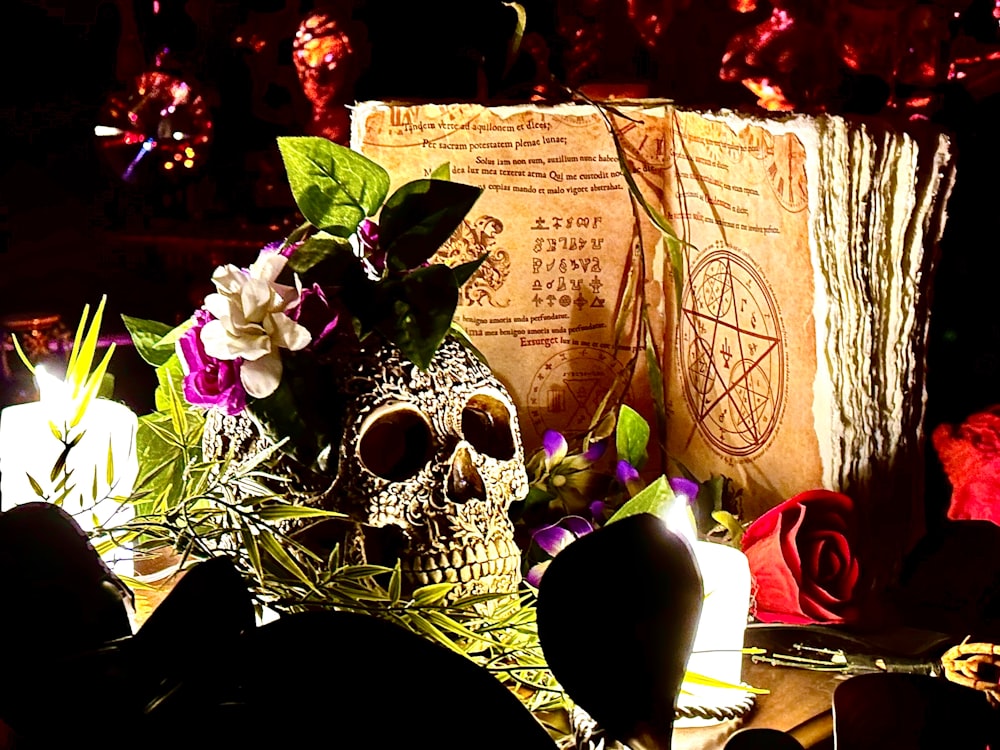 a skull vase with flowers on a table