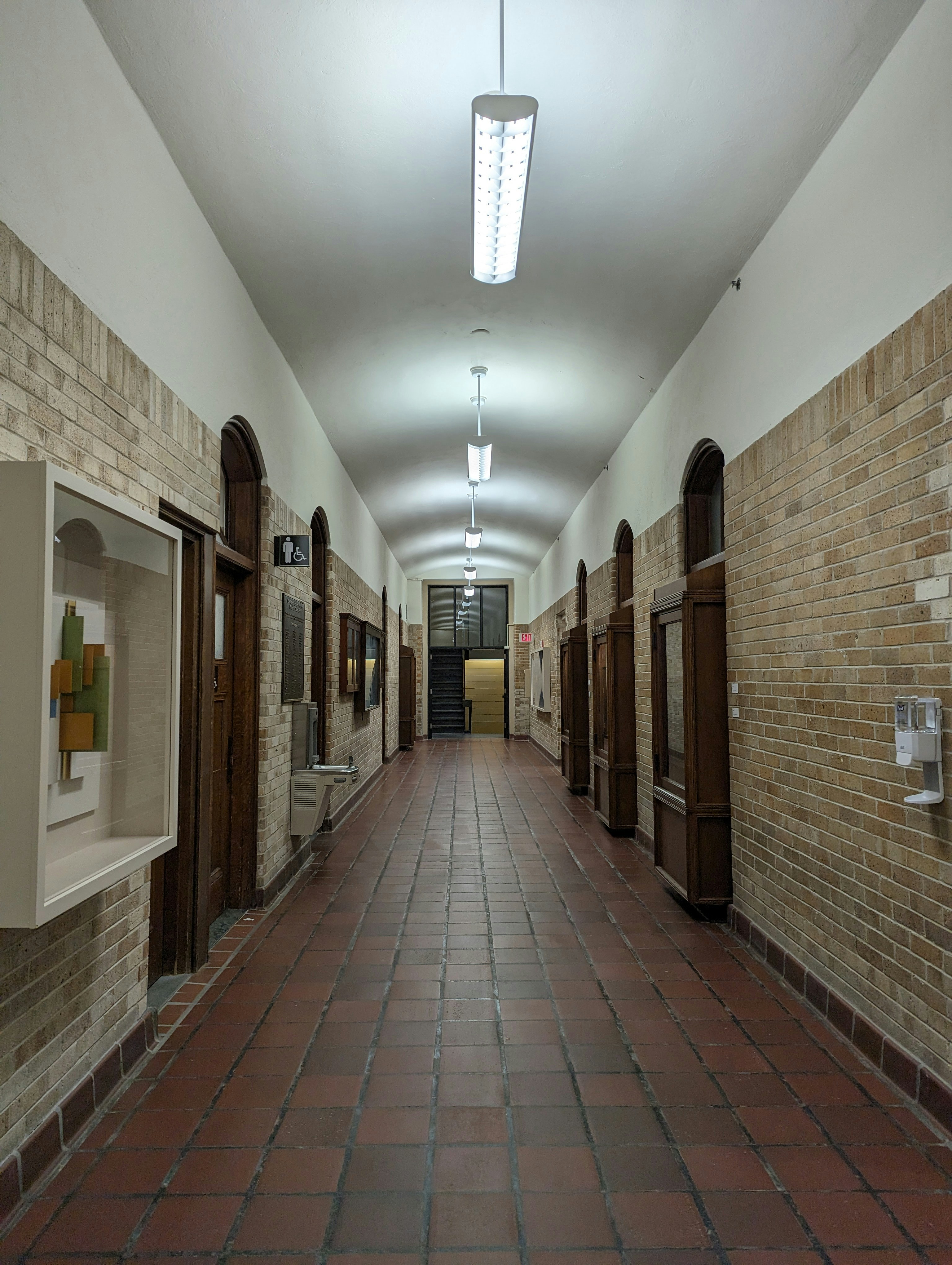 a long hallway with a bunch of doors