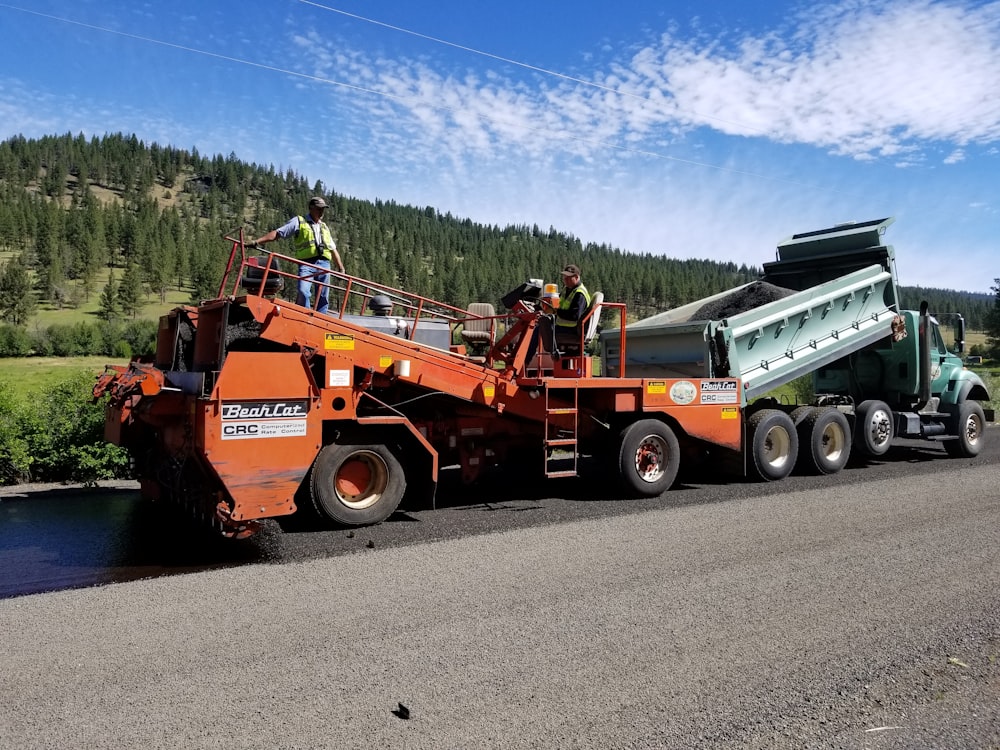 a large truck with a dump truck on the back of it