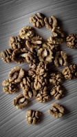 a pile of walnuts sitting on top of a table