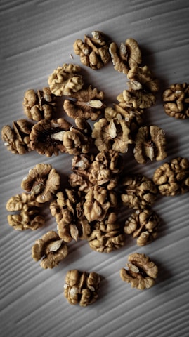 a pile of walnuts sitting on top of a table