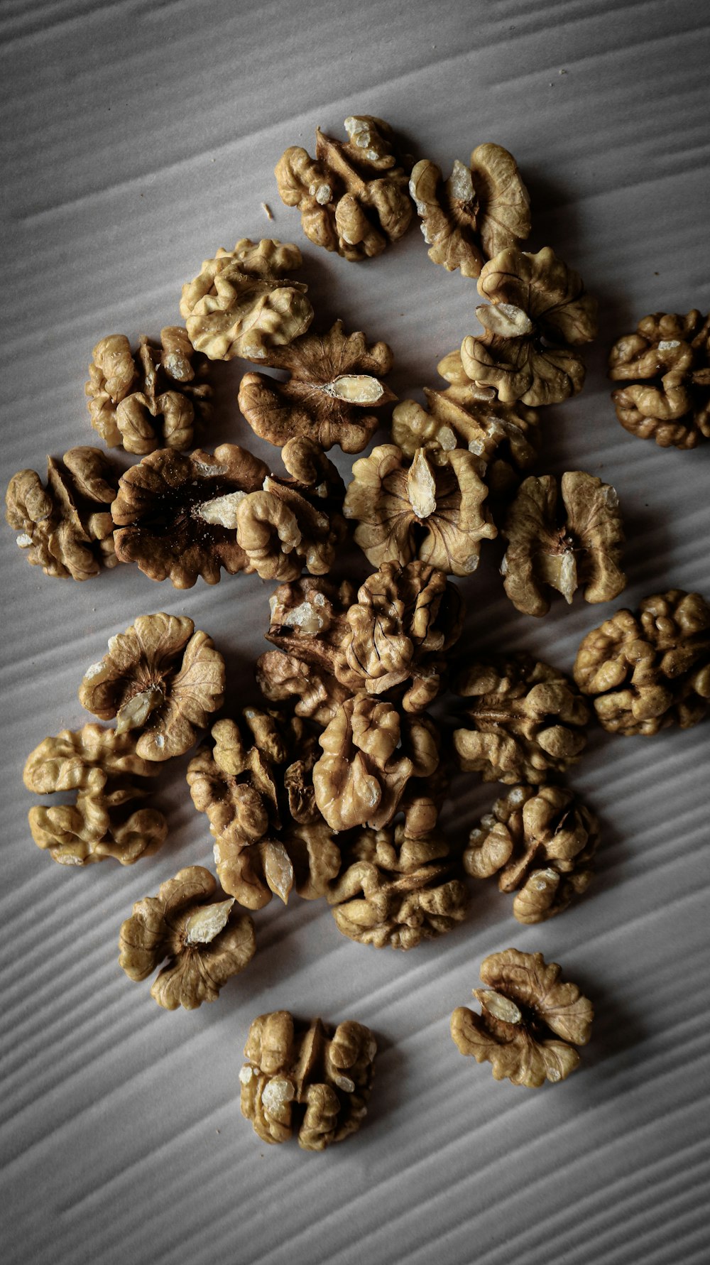 a pile of walnuts sitting on top of a table