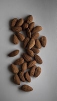 a pile of almonds sitting on top of a table