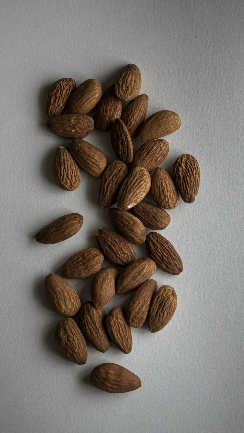 a pile of almonds sitting on top of a table