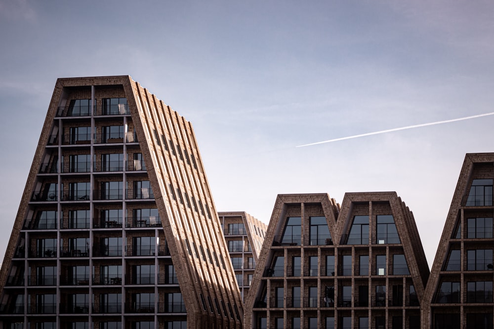 a couple of tall buildings sitting next to each other