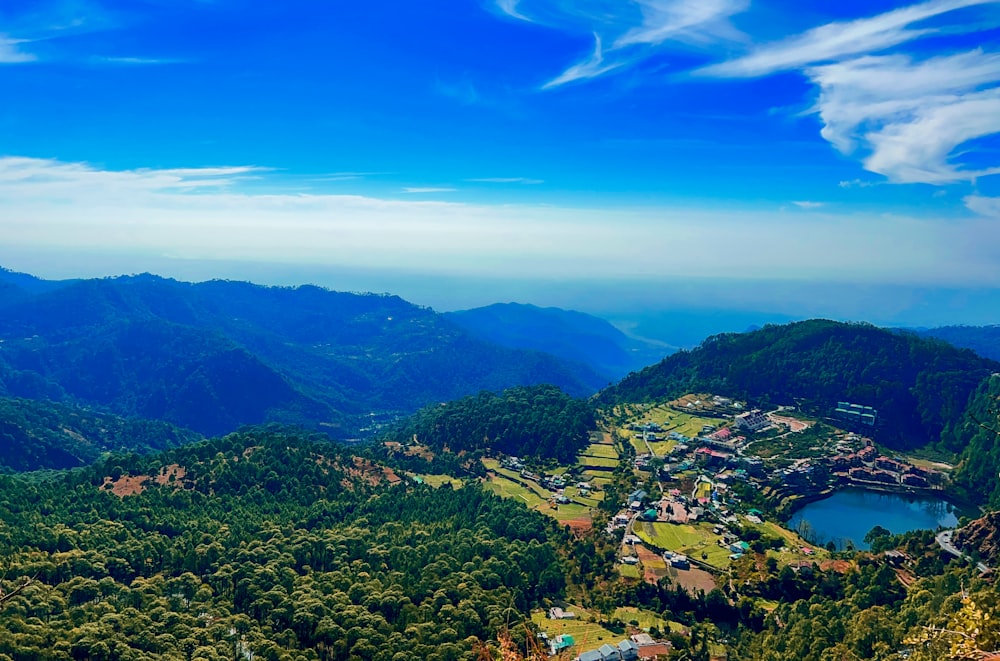 a scenic view of a valley surrounded by mountains