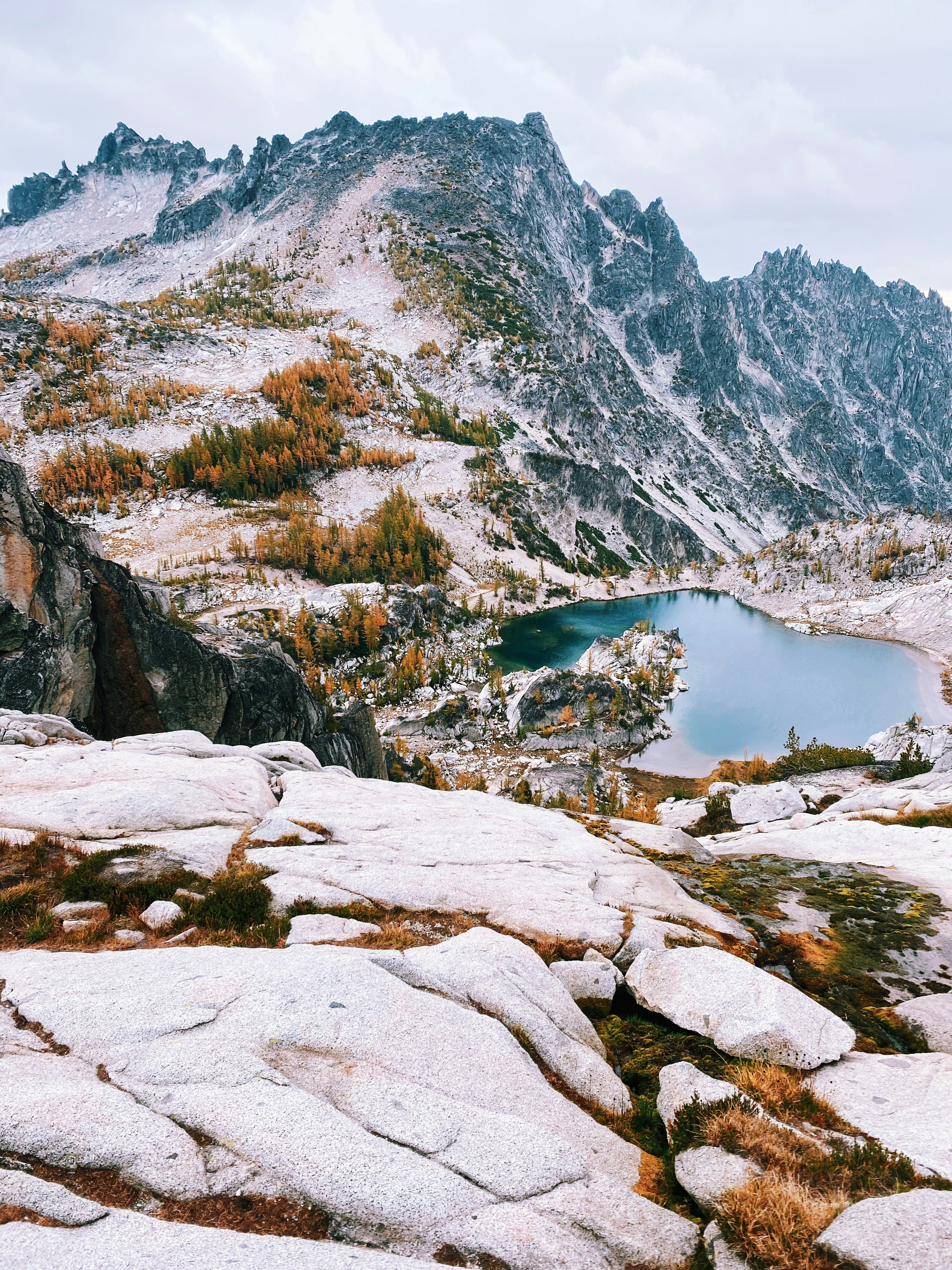 a mountain with a lake in the middle of it