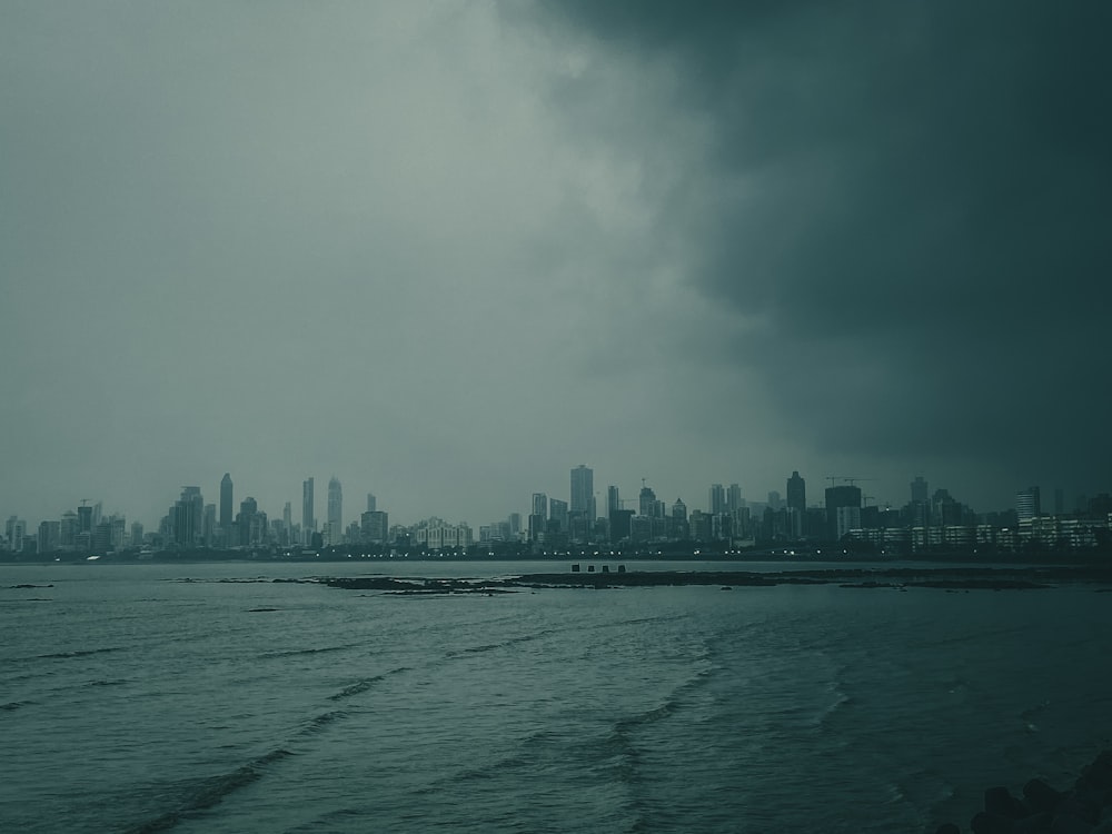 a large body of water with a city in the background