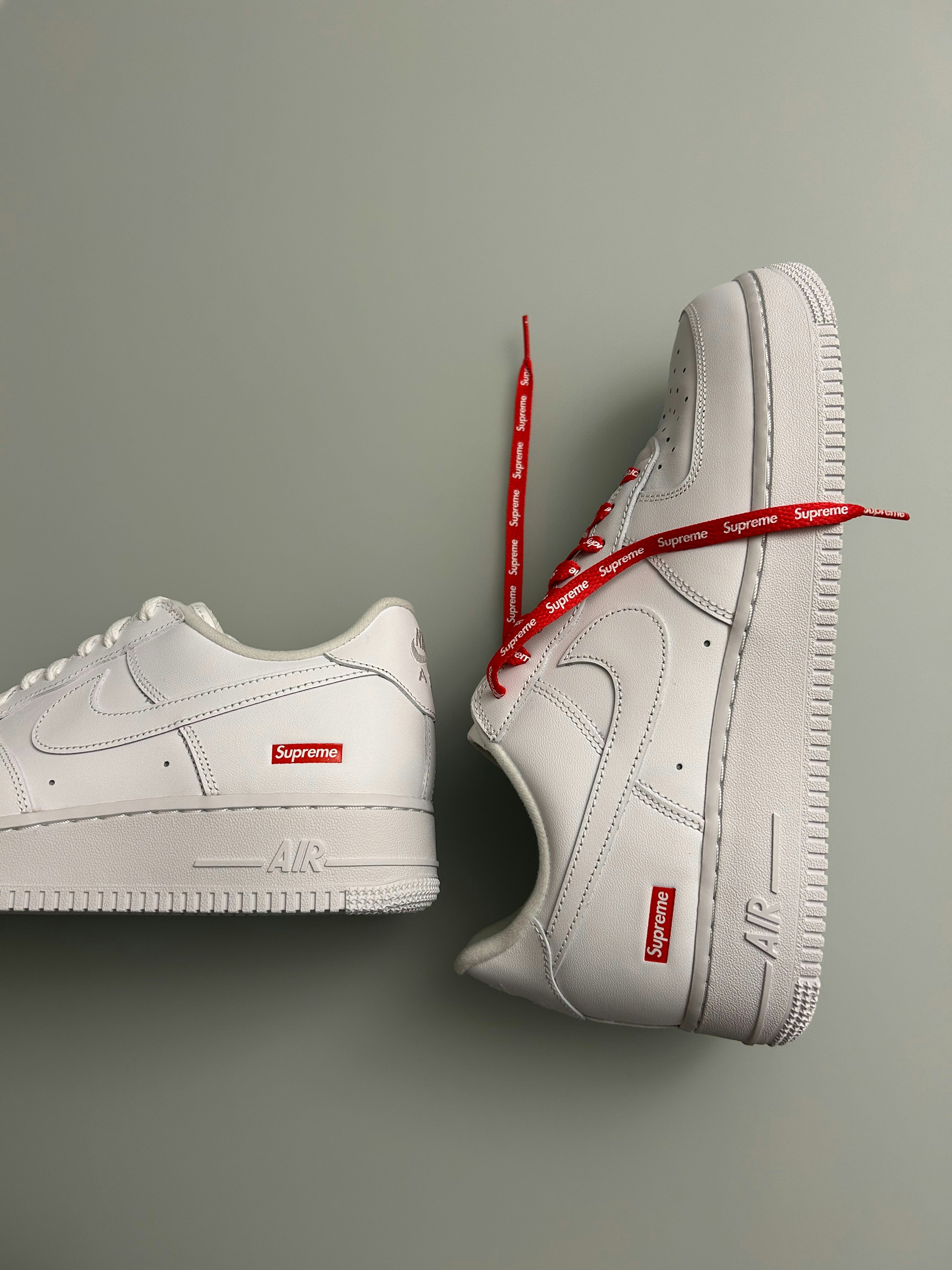 A pair of white sneakers with a red ribbon photo – Free Fashion Image ...