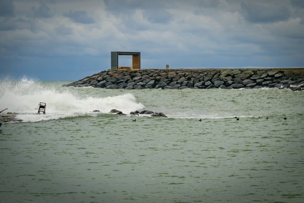 a person riding a surfboard on a wave in the ocean