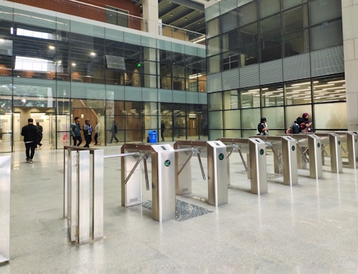 a group of people walking around a building
