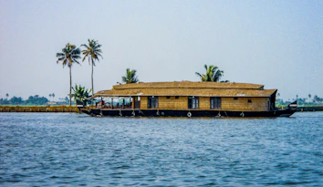 a house boat is floating on the water