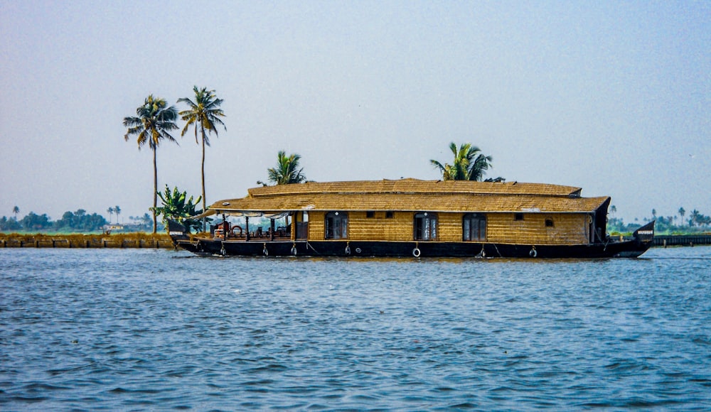 a house boat is floating on the water