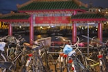 a bunch of bikes parked in front of a building