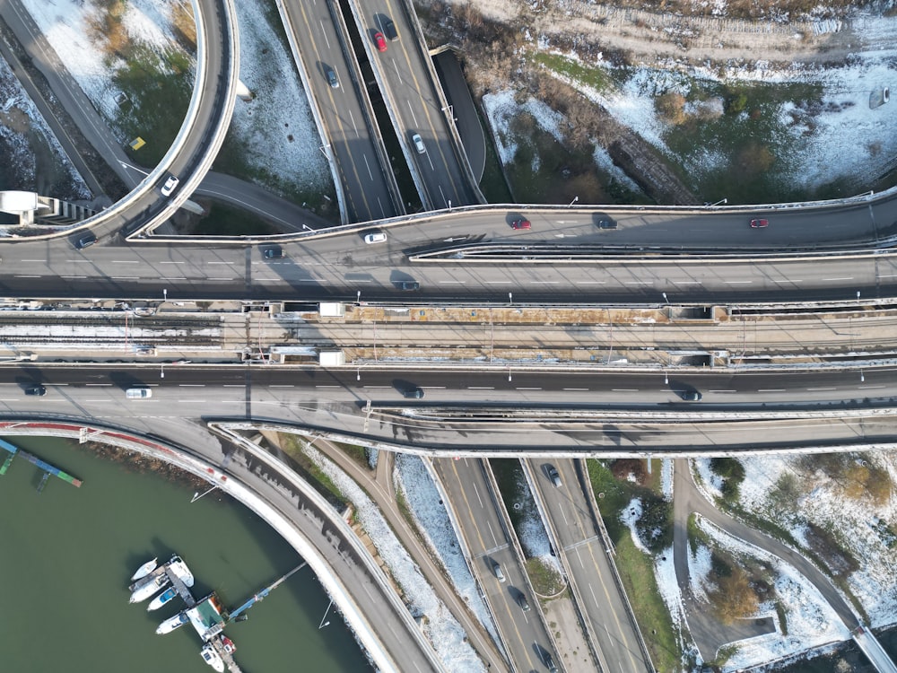 an aerial view of a highway intersection in winter