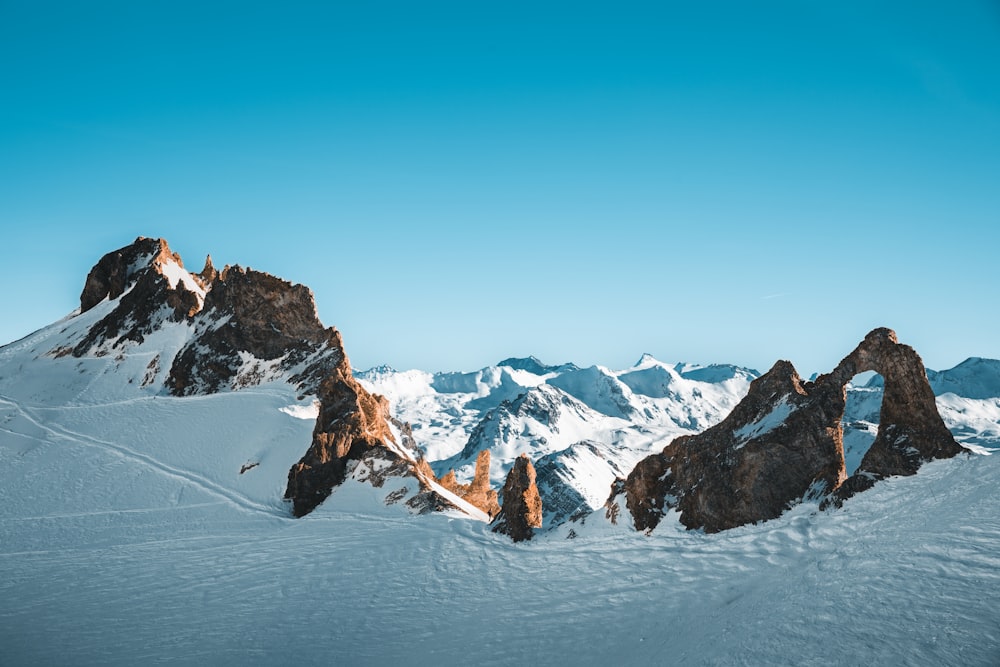 a snow covered mountain with a sky background