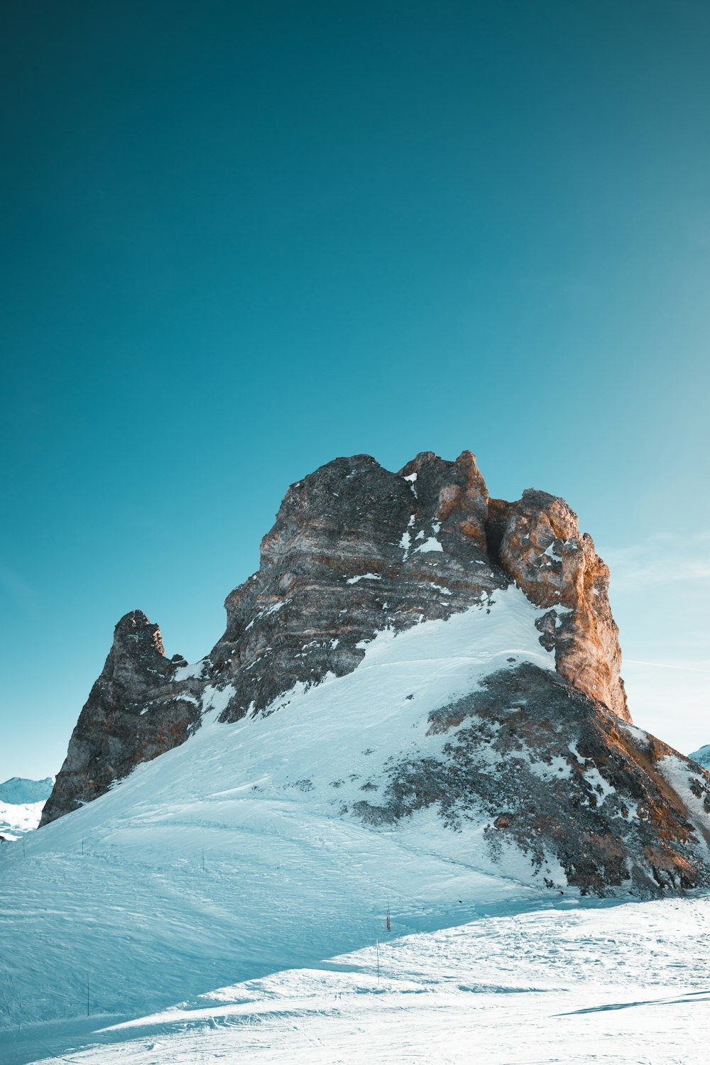 a man riding skis on top of a snow covered slope