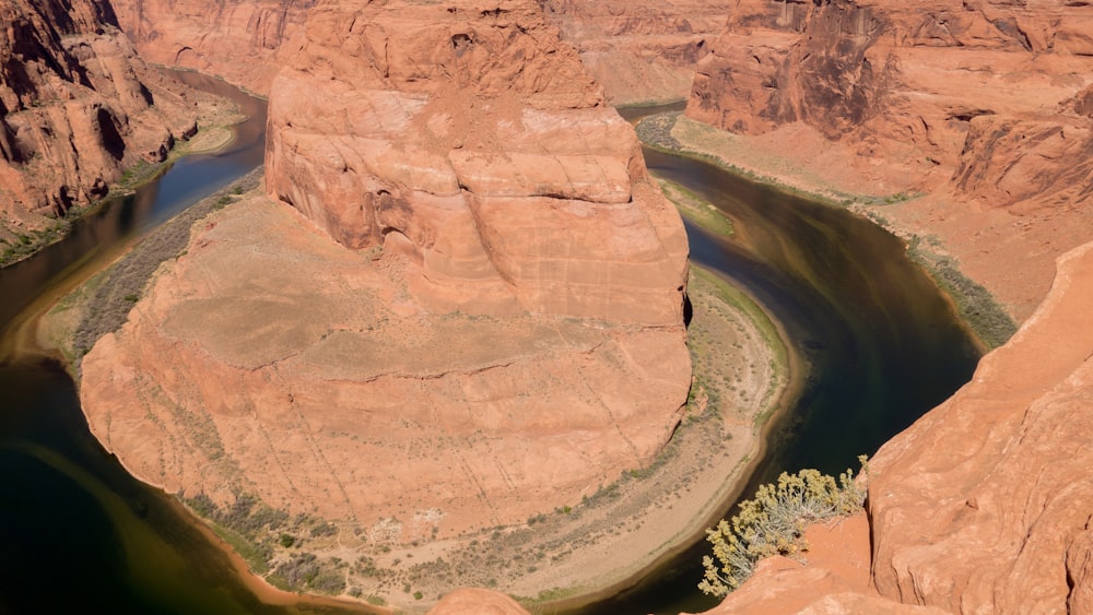 a river running through a canyon surrounded by mountains