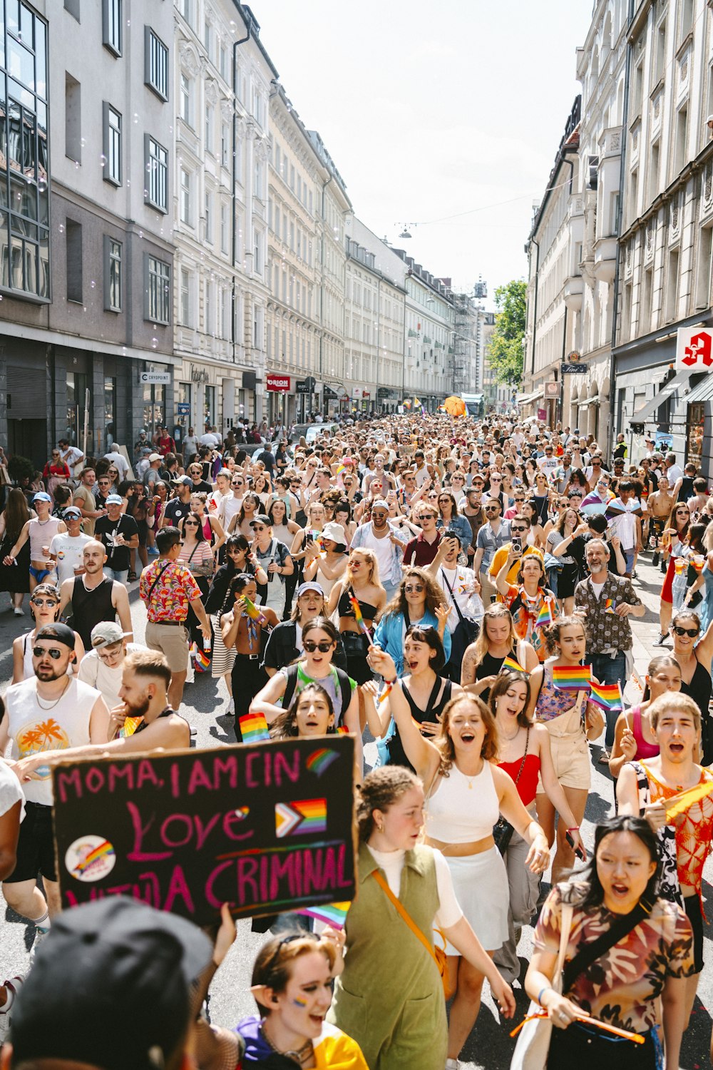 a large group of people walking down a street