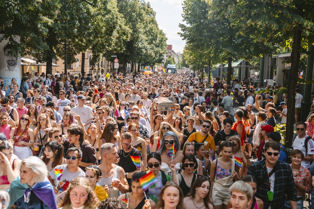 a large group of people walking down a street