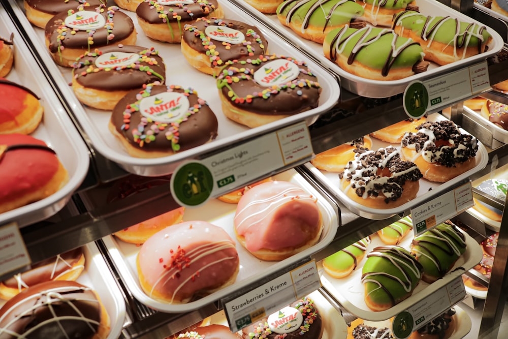 a display case filled with lots of different types of donuts