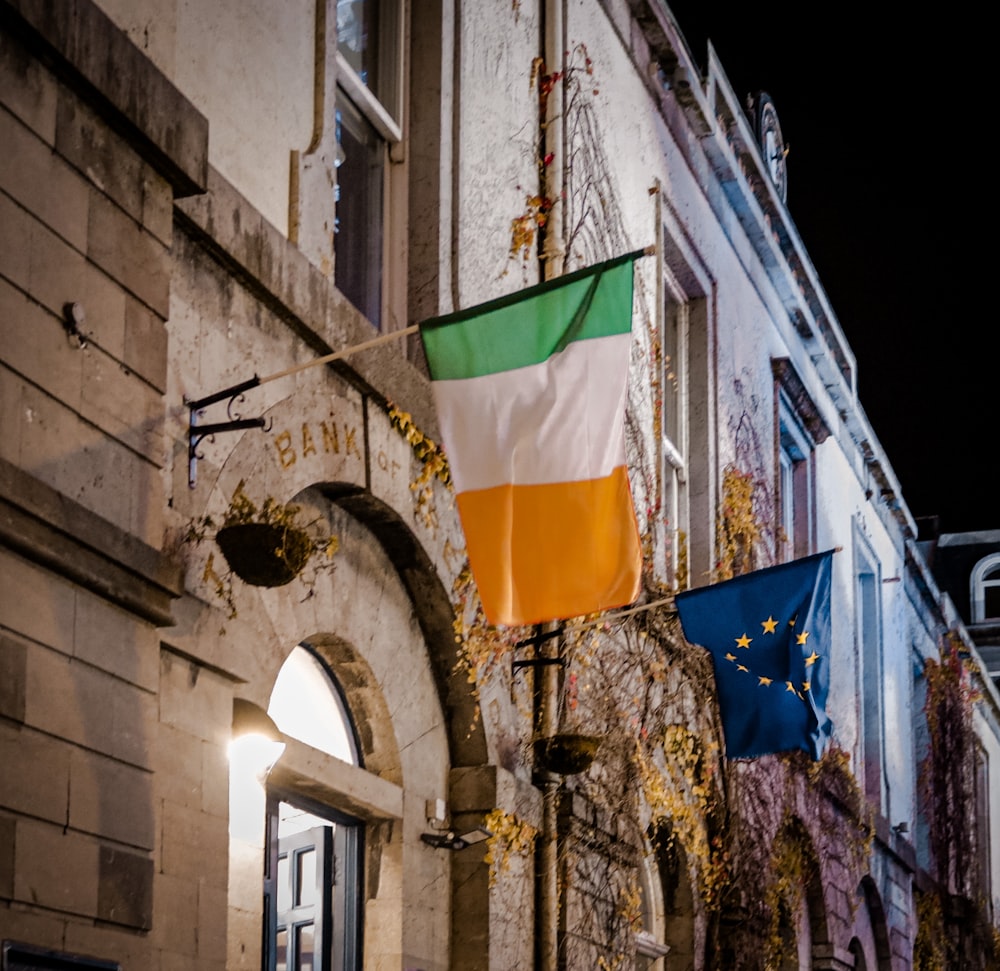 a flag hanging from the side of a building