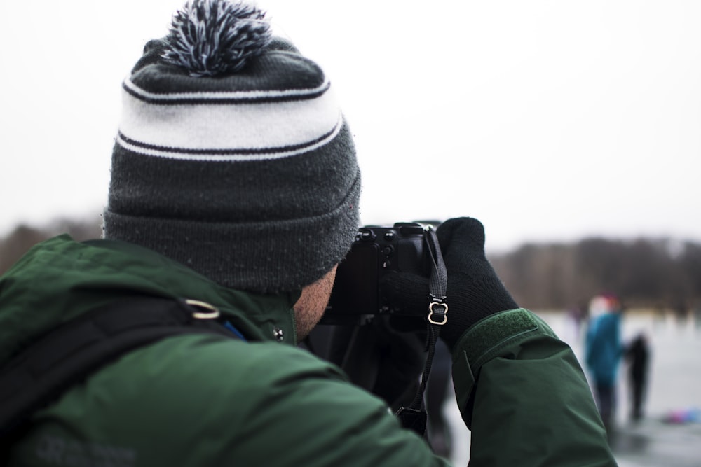 a man taking a picture of a group of people