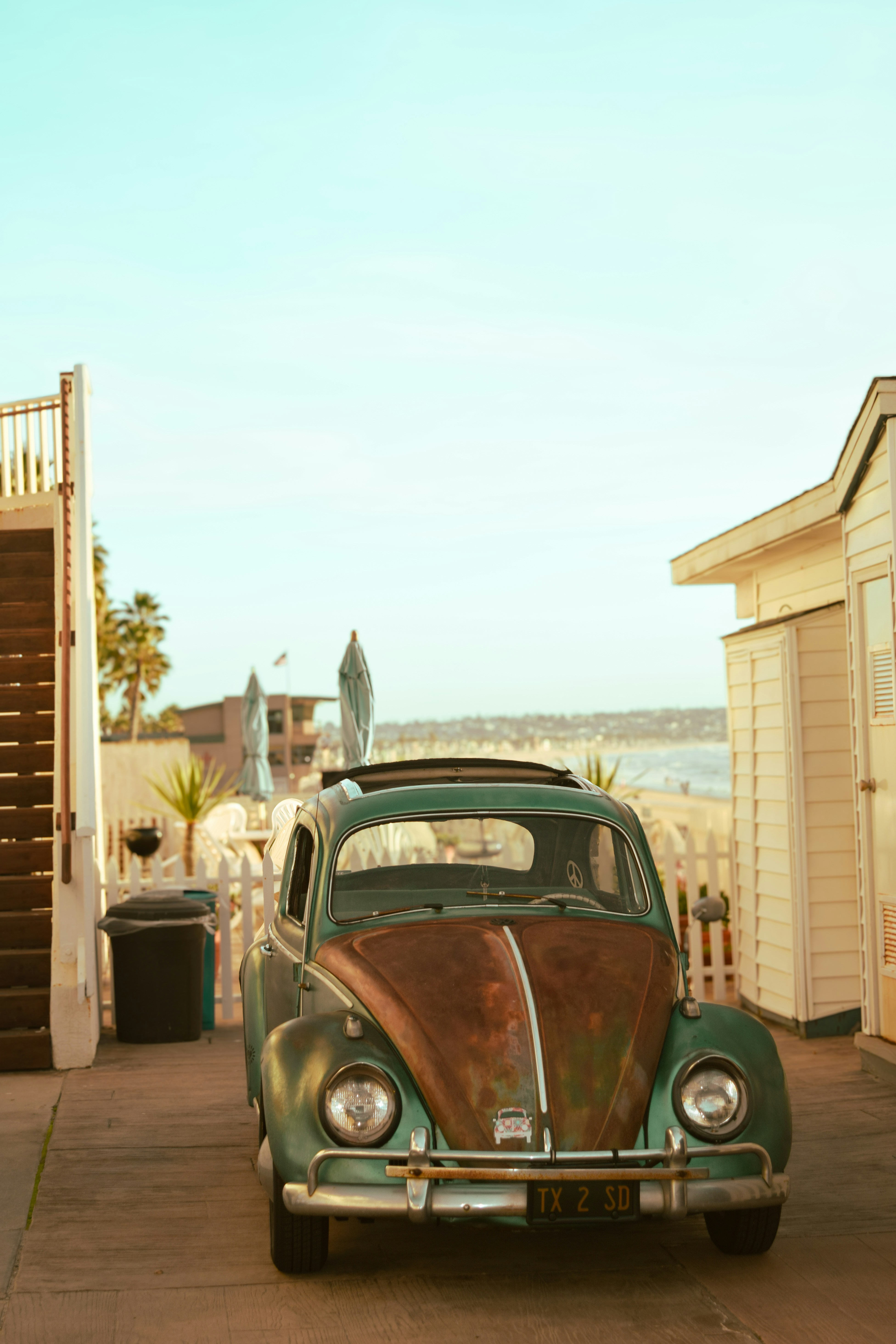 an old car parked on the side of the road
