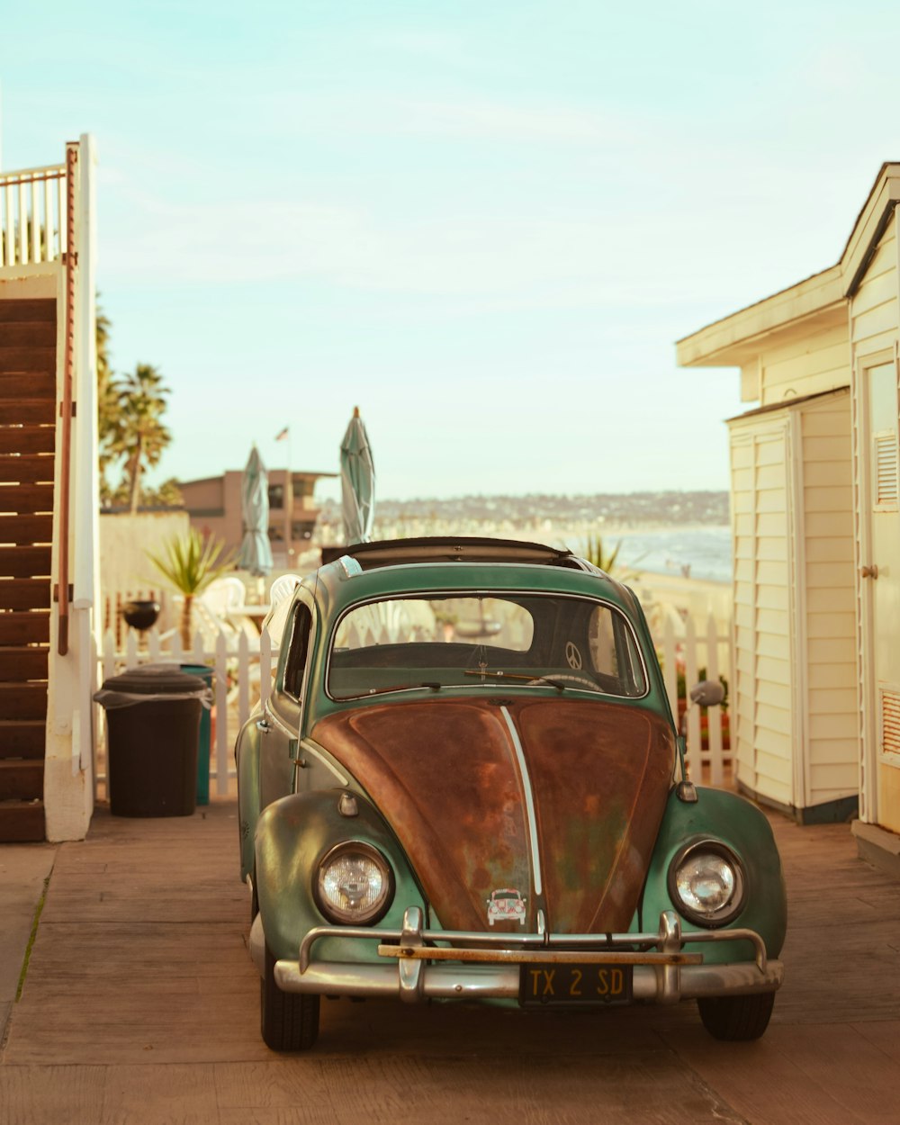 an old car parked on the side of the road