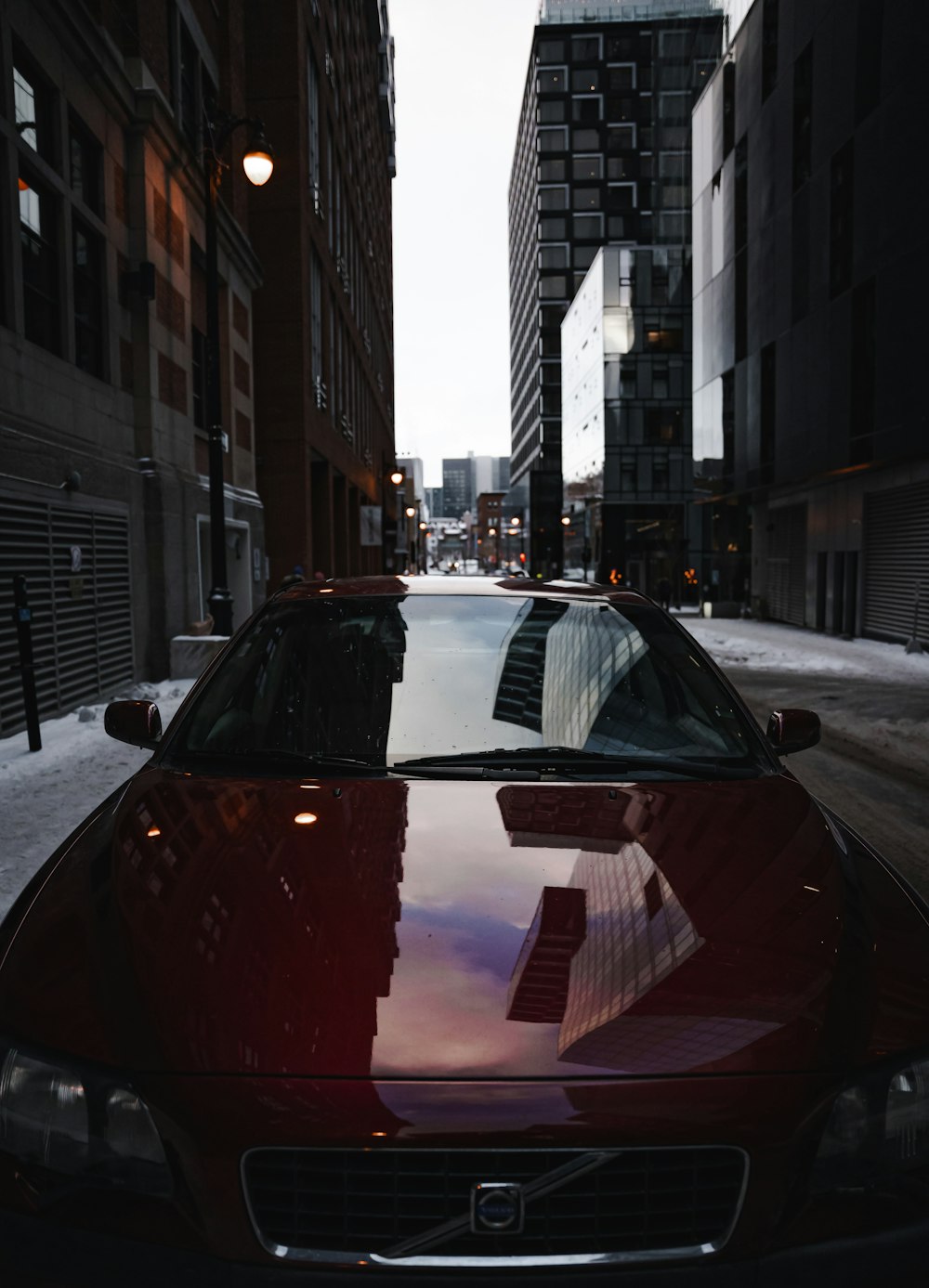 a red car parked on the side of a street