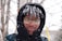 a young man wearing glasses in the snow